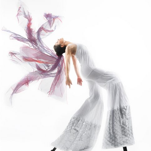 stilt dancer on white - performing arts - harderlee